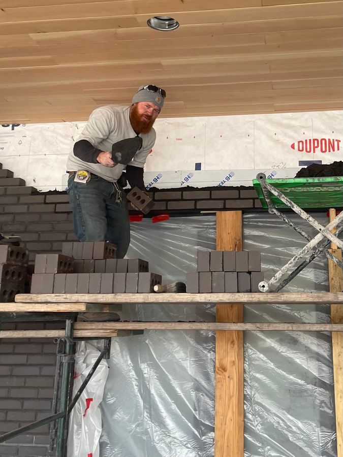 Laying brick from the scaffold