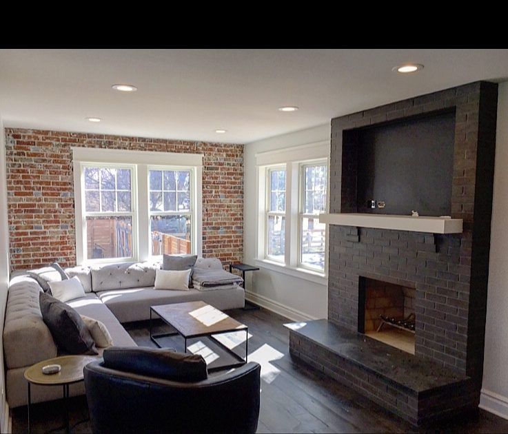Brick fireplace in a finished living room